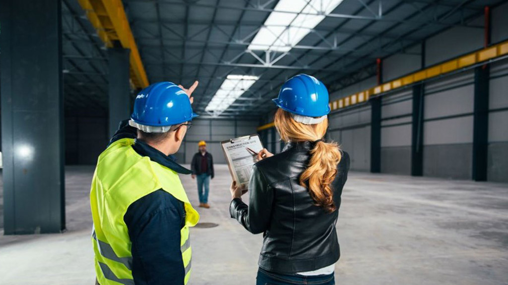 Two workers conducting workplace safety audits