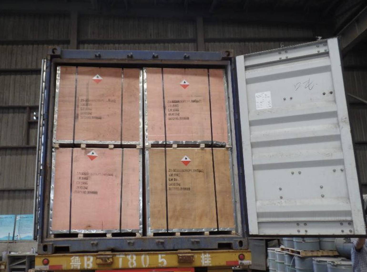 Crated industrial mining materials inside a shipping container for Australia–China mining delivery